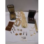 A mixed lot including faux pearls, Dunhill lighter, silver gilt name necklace, collar studs etc.,