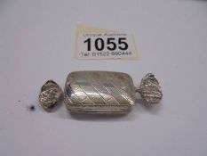 A silver pill box in the shape of a wrapped sweet, 13 grams.