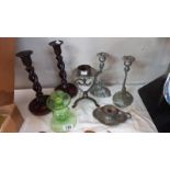 A pair of 1930's oak barley twist candlesticks, a pair of serpent candlesticks & 3 others