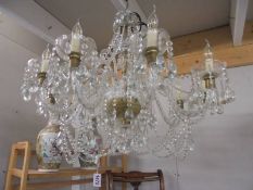 A large ten light glass chandelier. COLLECT ONLY.