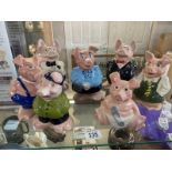 A collection of Wade Nat West Pigs including full family and Cousin Wesley