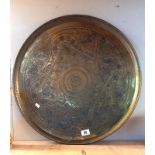 A large brass tray - diameter 58cm