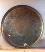 A large brass tray - diameter 58cm