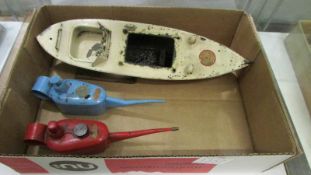 Two Sutcliffe Oiler oil cans and a battery operated boat for restoration.