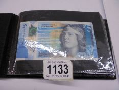A folder of assorted bank notes including 10/-, £1, £5 etc., abd WW2 emergency blue £1.