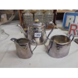 A three piece silver plate tea set.