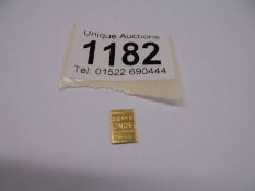 A 1 gram fine gold bar.