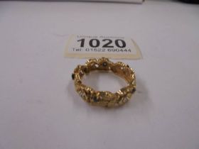 A gold ring set diamond and sapphires, marked 385, size S, 6.1 grams.