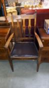 An arts and crafts oak carver chair with tulip cut out back slats, COLLECT ONLY