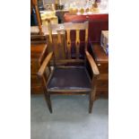 An arts and crafts oak carver chair with tulip cut out back slats, COLLECT ONLY