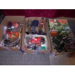 Three 1970's Action Man figures with a good selection of clothes and accessories, rifle rack,