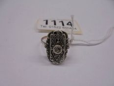 A 9ct gold and silver marcasite ring, size T.
