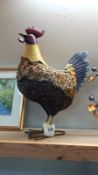 A full scale painted metal garden ornament of a cockerel
