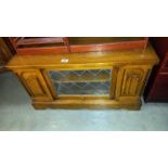 An oak TV stand with leaded glass door, COLLECT ONLY