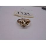 A unmarked ring set seed pearl (tests as 9ct) size L, 2.3 grams.