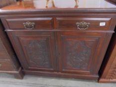 A mahogany sideboard with carved doors, COLLECT ONLY.