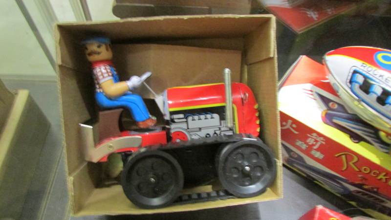 Four boxed tin plate clockwork toys including Robot, Knight, Rocket racer and bulldozer. - Image 3 of 5