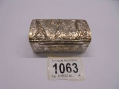An embossed silver box featuring a Grecian scene. 56 grams.