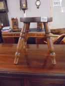 An old four leg farmhouse stool.