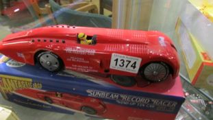 A boxed Fantastic & Co., tin plate clockwork Sunbeam Record racer.