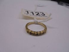 A unmarked ring (tests poss. 18ct) size K half, 1.6 grams.