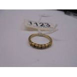 A unmarked ring (tests poss. 18ct) size K half, 1.6 grams.