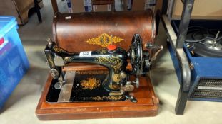 A vintage cased sewing machine COLLECT ONLY