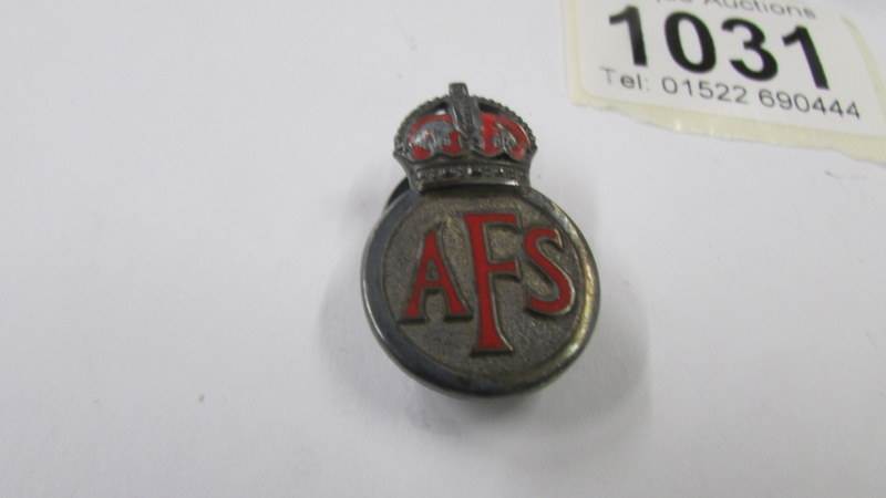 A silver AFS badge and another silver badge. - Image 2 of 3