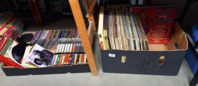 A box of LP records and a box of singles, cd's and cassettes COLLECT ONLY