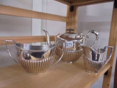 A three piece silver plate tea set.