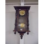 A mahogany wall clock.