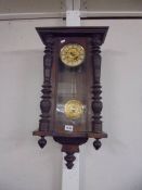 A mahogany wall clock.