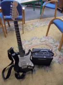 A Fender Squire S/N ICS 15082485 guitar with soft case, instruction books and Blackstar Amplifier,