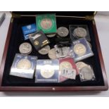 A collector's coin case and a quantity of crown size coins.