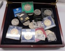 A collector's coin case and a quantity of crown size coins.
