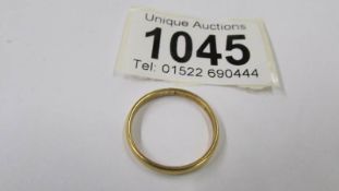 A 22ct gold wedding ring, size P, 2.4 grams.