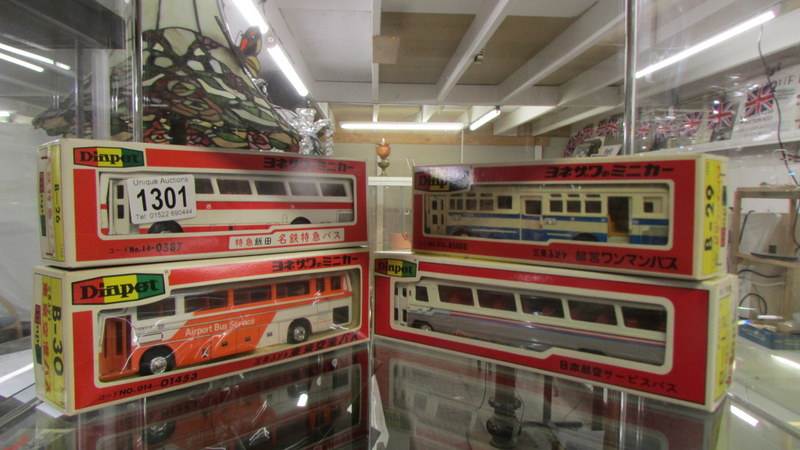 Four boxed Yonezawa Diapet die cast buses.