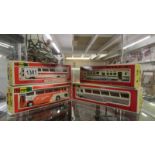 Four boxed Yonezawa Diapet die cast buses.