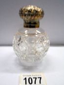 A nice Hobnail cut silver topped scent bottle.