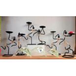 A quantity of candlesticks & 3 clear glass dolphins