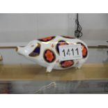 A Royal Crown Derby pig paperweight.