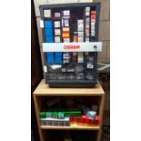 A vintage garage Osram car light bulb shop display cabinet and varied selection of boxed bulbs