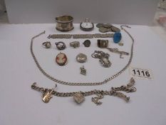 A mixed lot including silver rings. silver chain, charm bracelet, silver coins etc., over 170 grams