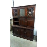 A dark oak wall unit with leaded glass doors, COLLECT ONLY