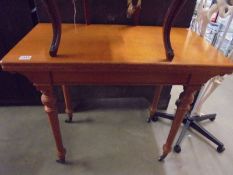 A mahogany table on castors, COLLECT ONLY.