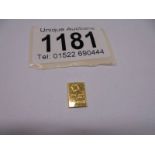 A 1 gram fine gold bar.