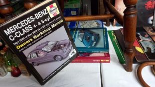 A quantity of Haynes manuals including Mercedes-Benz C-Class