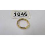 A 22ct gold wedding ring, size P, 4 grams.