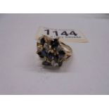 A diamond sapphire cluster ring, 11 marquise cut sapphires and 8 diamonds in a 9ct gold setting