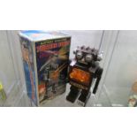 A boxed 'S.H.' Japan battery operated fighting robot.